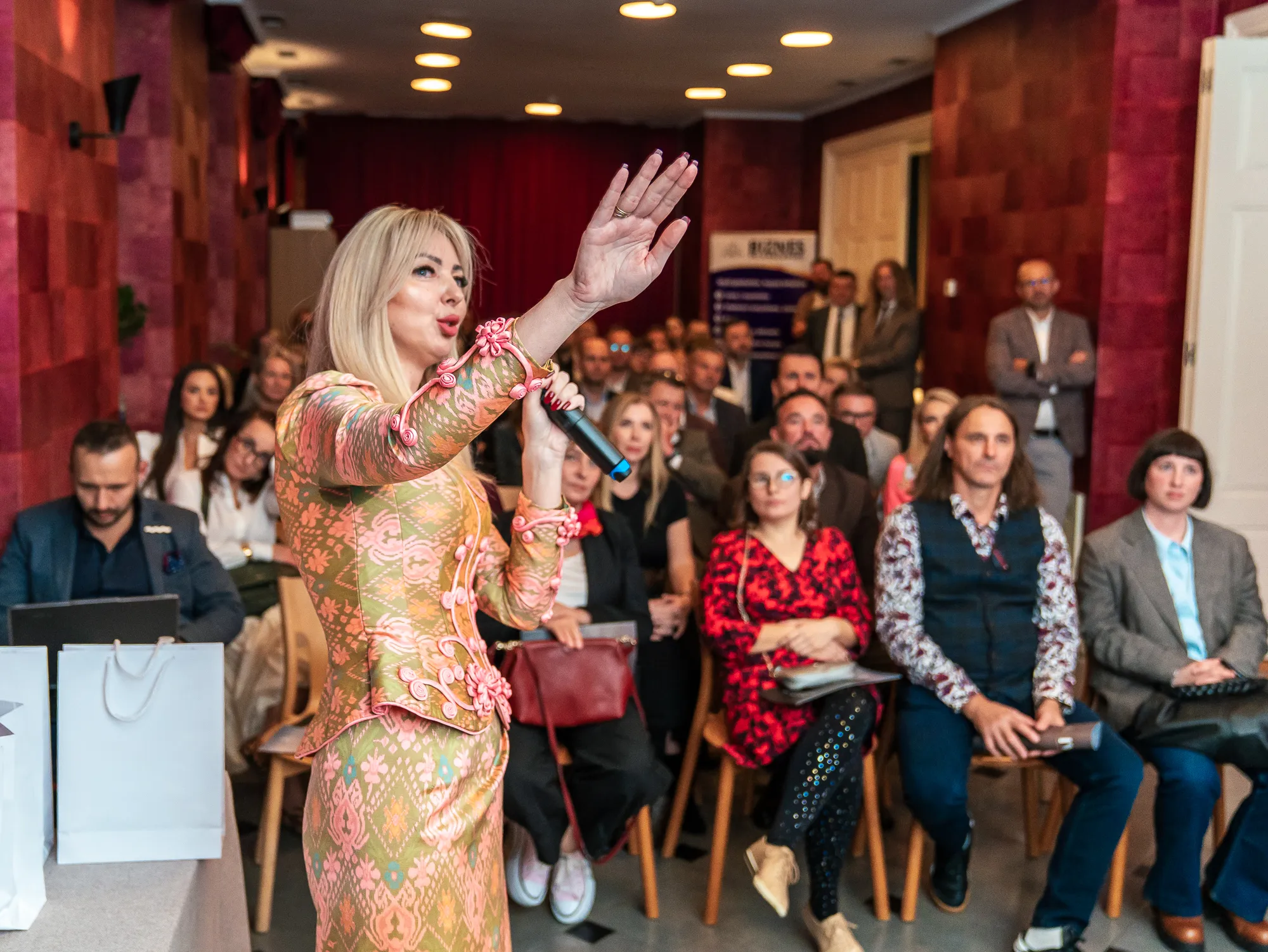Iwona Kmiecik with a microphone during a panel